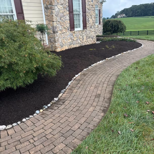 Lawn care and landscaping project by Tim's Outdoor Services