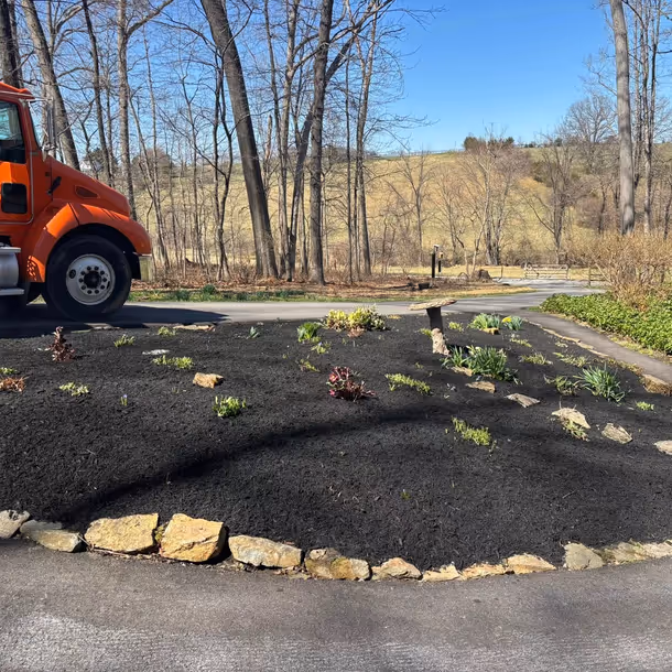 Lawn care and landscaping project by Tim's Outdoor Services