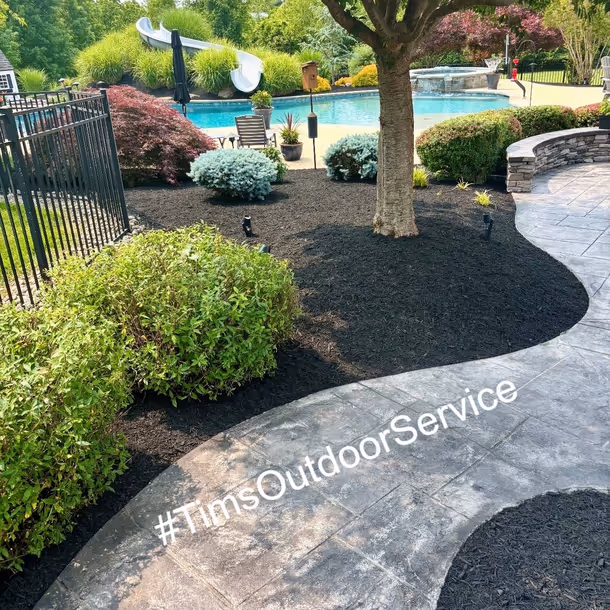 Lawn care and landscaping project by Tim's Outdoor Services
